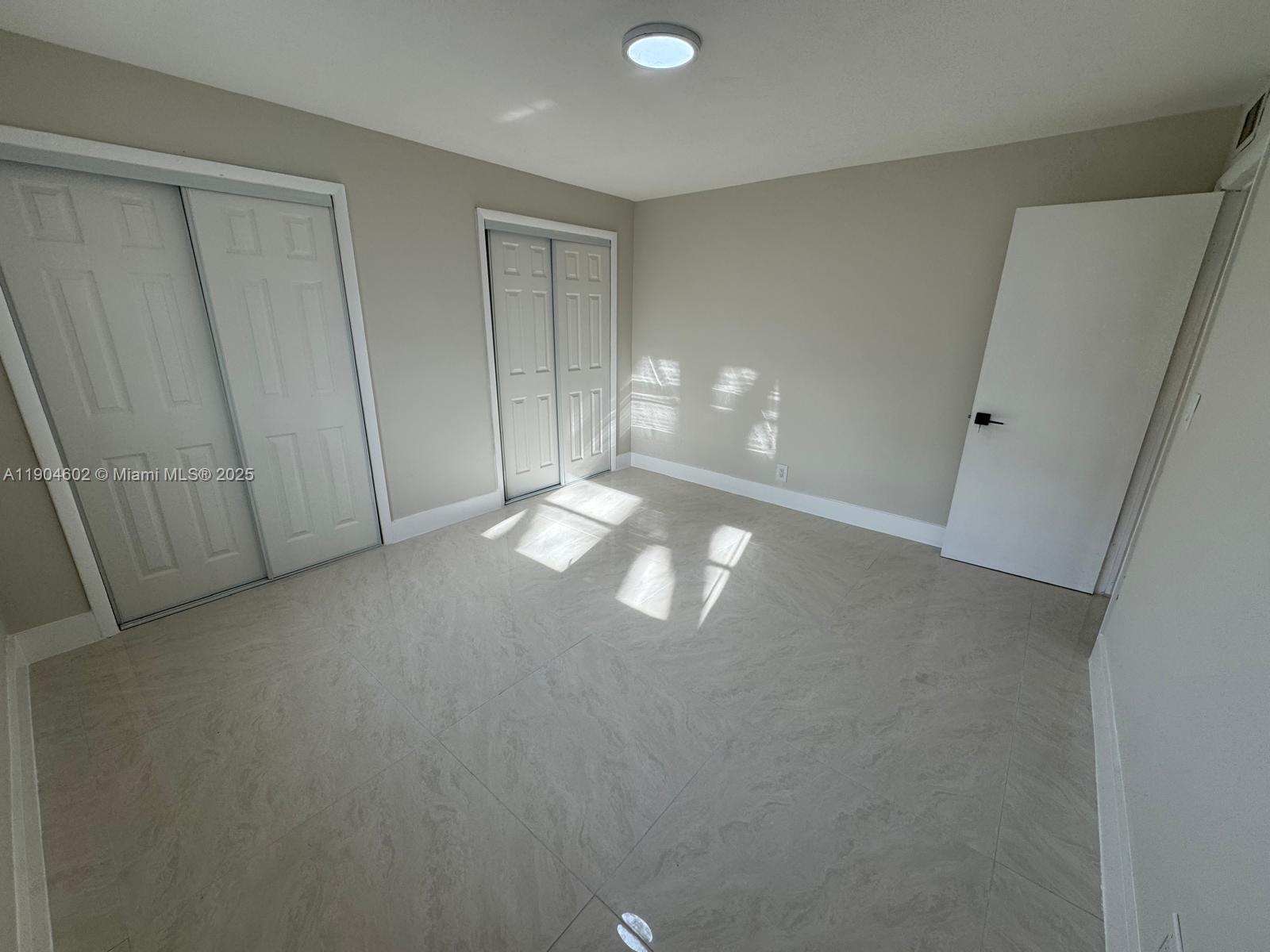 2418 Polk Street, Unit 104 Hollywood, FL 33020 - Photo 12 of 16 a view of empty room