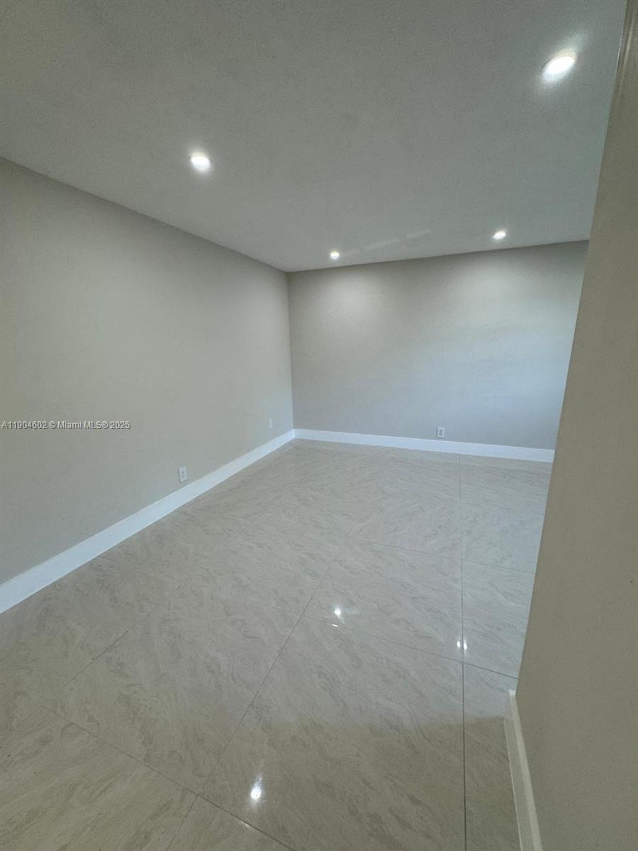 2418 Polk Street, Unit 104 Hollywood, FL 33020 - Photo 16 of 16 a view of an empty room