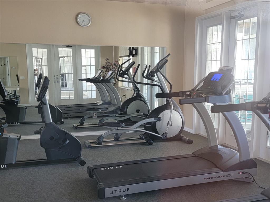3705 Southwest 27th Street, Unit 1016 Gainesville, FL 32608 - Photo 27 of 31 a view of a room with gym equipment
