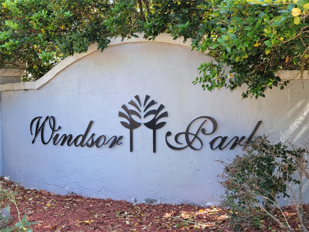 3705 Southwest 27th Street, Unit 1016 Gainesville, FL 32608 - Photo 30 of 31 a street sign that is on a brick wall