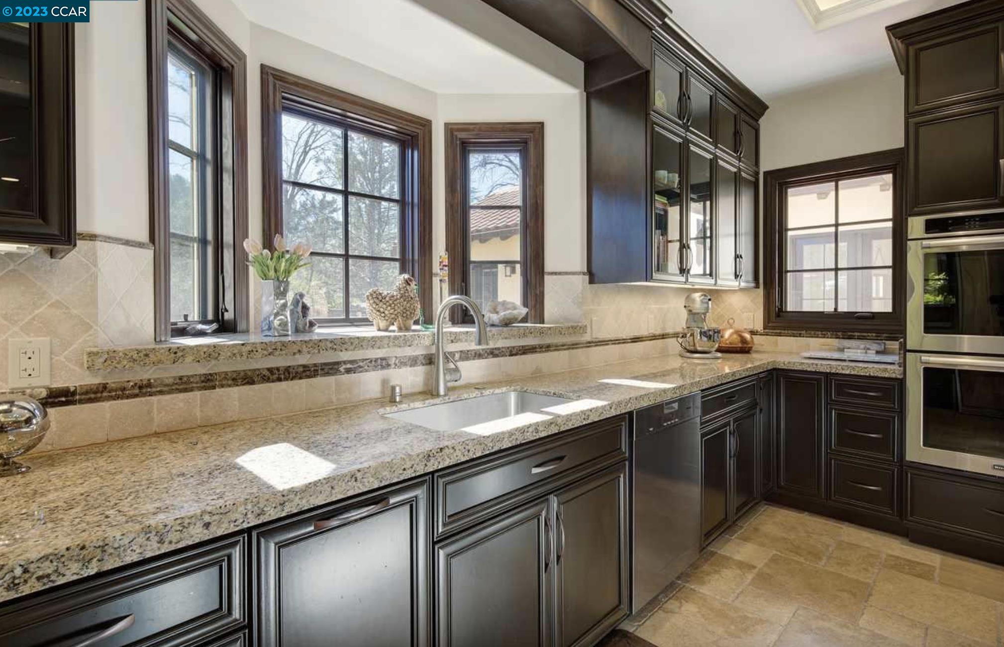 23 Eckley Lane Walnut Creek, CA 94596 - Photo 14 of 47 a kitchen with stainless steel appliances granite countertop a sink and a counter space