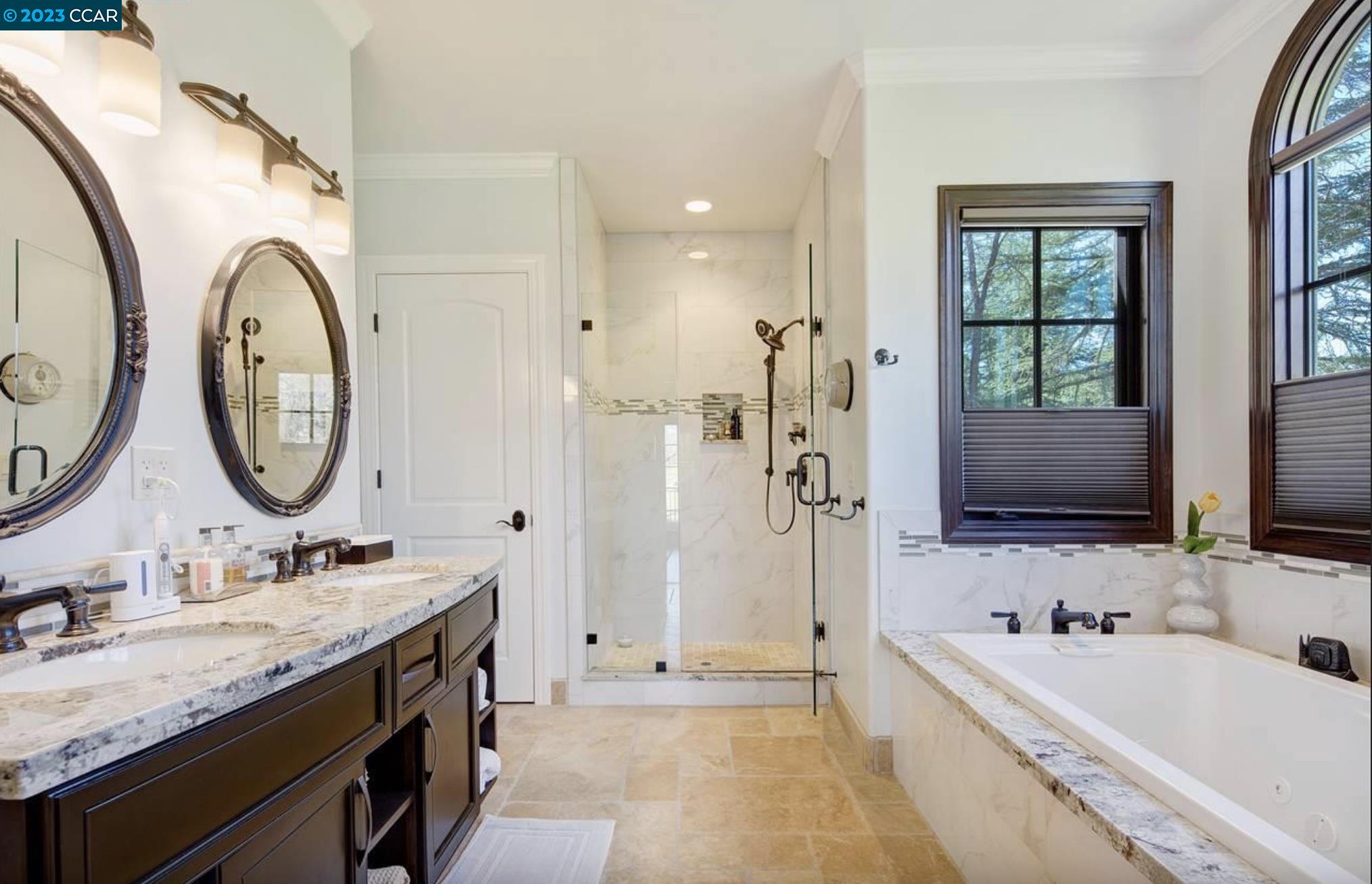 23 Eckley Lane Walnut Creek, CA 94596 - Photo 27 of 47 a bathroom with a granite countertop tub sink and mirror