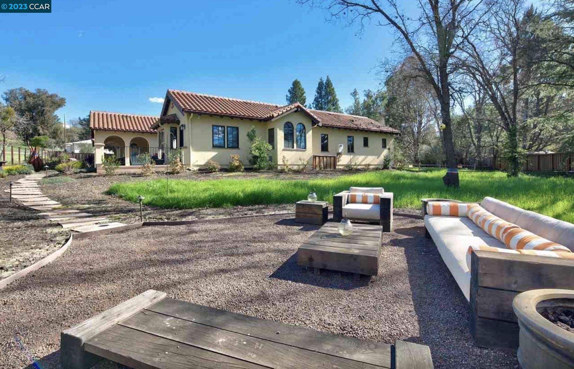 23 Eckley Lane Walnut Creek, CA 94596 - Photo 33 of 47 a view of a house with backyard sitting area and garden