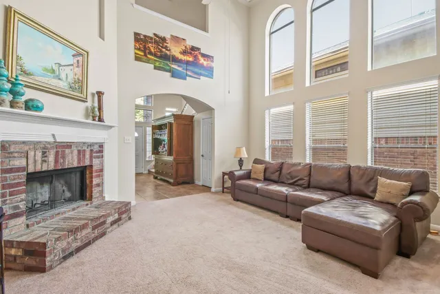 a view of a dining room with furniture and chandelier