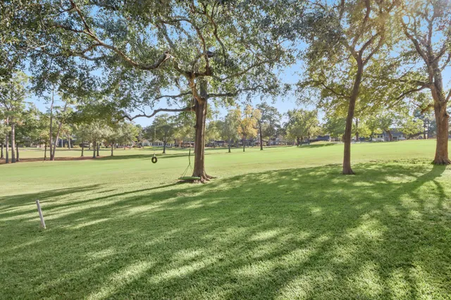 a view of a golf course with a trees