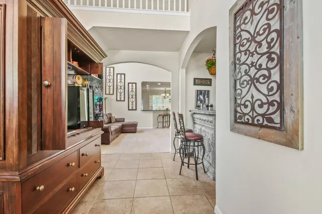 a living room with granite countertop furniture and a potted plant