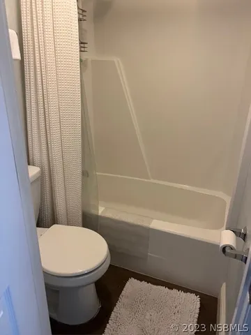 a bedroom with a bed and a table