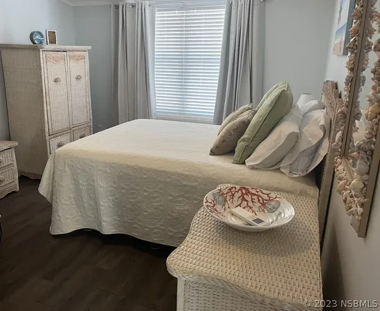 a living room with furniture a table and a window