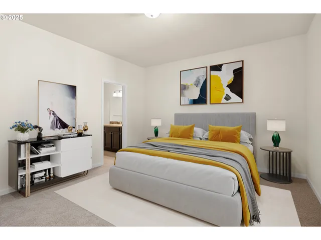 a bedroom with a bed and a lamp on table