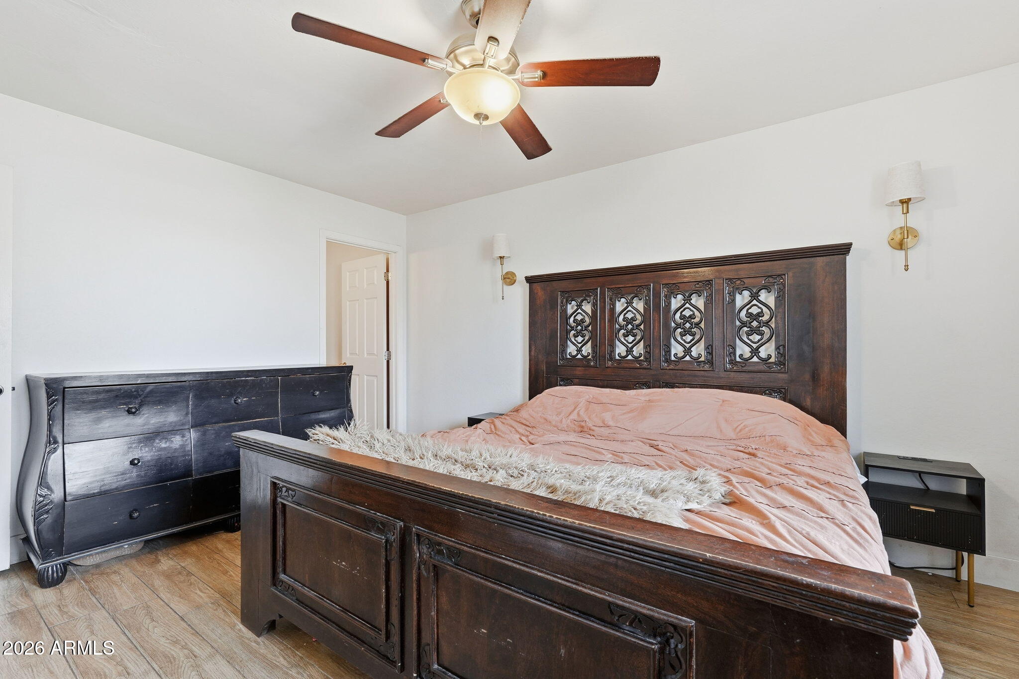 2858 East Redfield Road Gilbert, AZ 85234 - Photo 32 of 60 a bedroom with a bed and a dresser