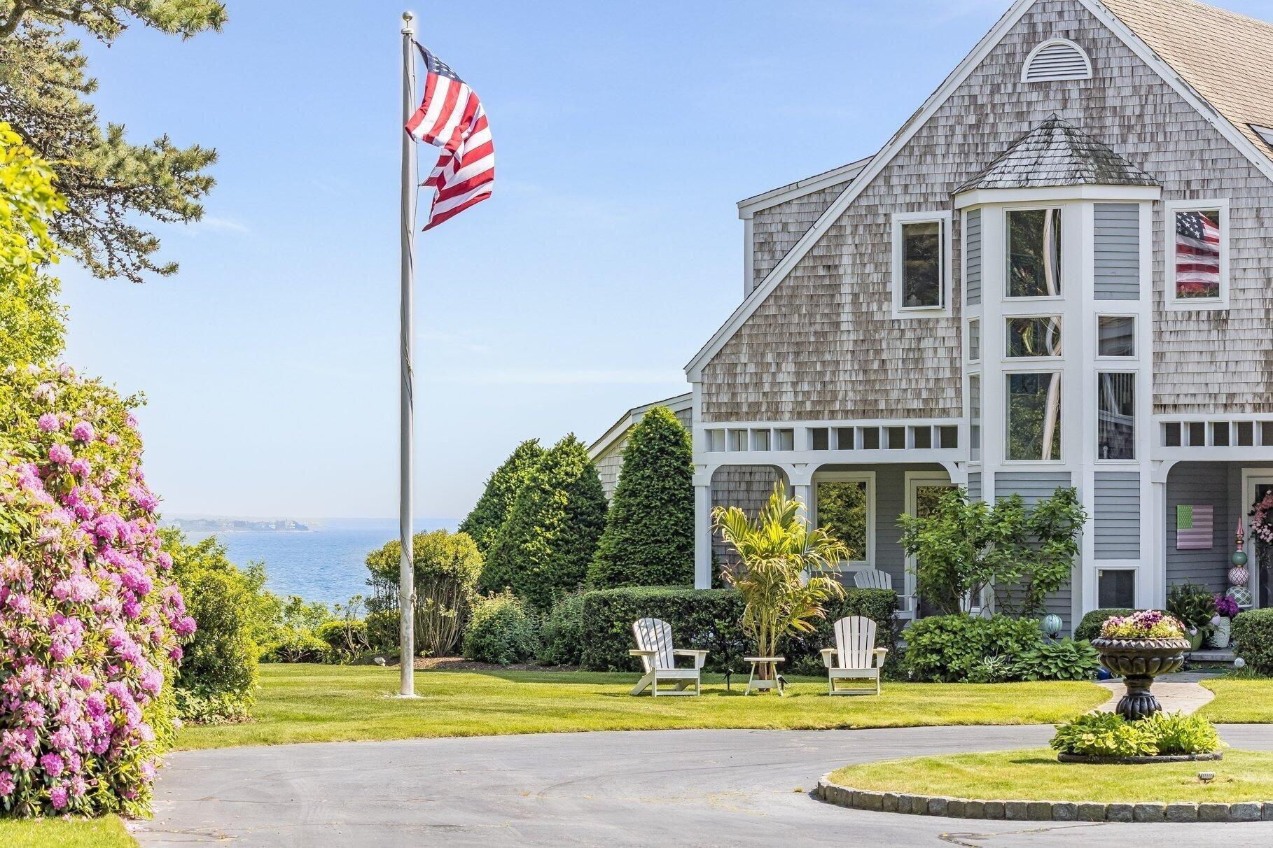 461 Wings Neck Road Pocasset, MA 02559 - Photo 6 of 42 a front view of a house with a yard