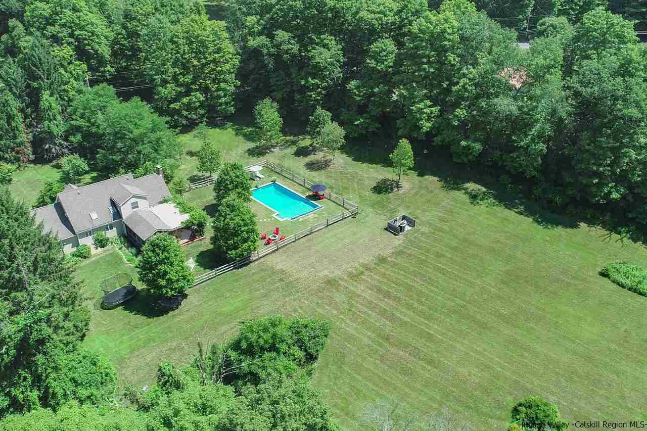 173 Peak Road Stone Ridge, NY 12484 - Photo 1 of 34 an aerial view of residential house with outdoor space and trees all around