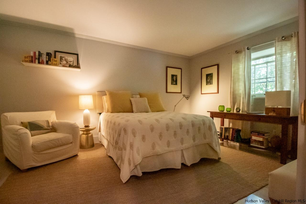 173 Peak Road Stone Ridge, NY 12484 - Photo 22 of 34 a bedroom with a bed and a couch