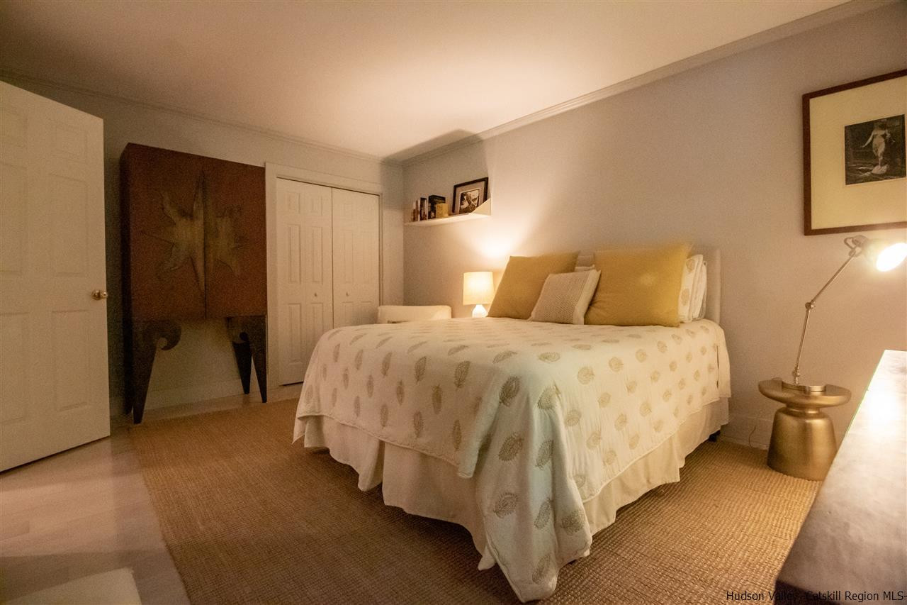 173 Peak Road Stone Ridge, NY 12484 - Photo 24 of 34 a bedroom with a bed and closet