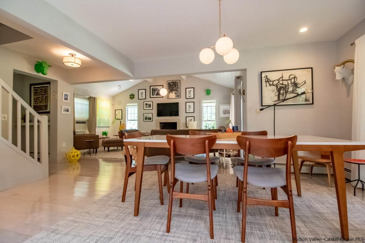 173 Peak Road Stone Ridge, NY 12484 - Photo 10 of 34 a view of a dining room with furniture and wooden floor