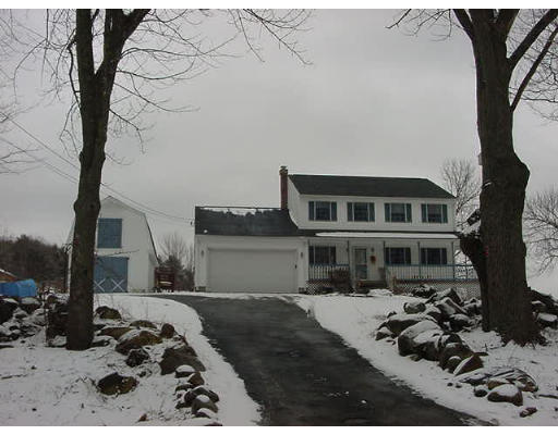 1015 Reed Street Warren, MA 01092 - Photo 1 of 1 a front view of a house with a yard covered in snow