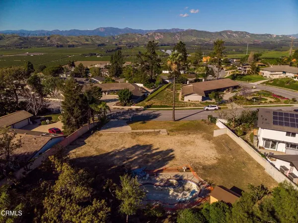 a view of a city with mountains in the background