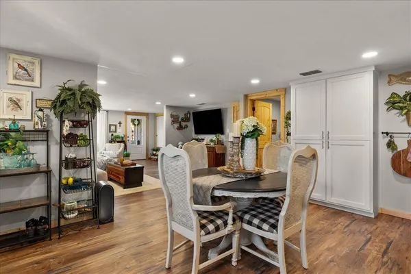 a bedroom with a bed and a large mirror