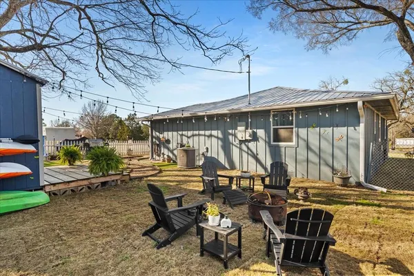 a view of a house with swimming pool and sitting area