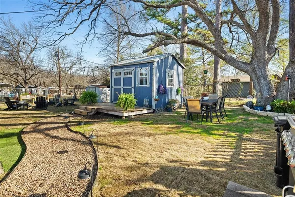 a view of a house with swimming pool and sitting area
