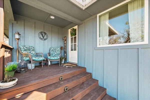 a living room with furniture and a clock