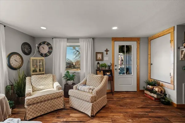 a living room with furniture and a large window