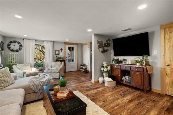 a living room with furniture and a large window