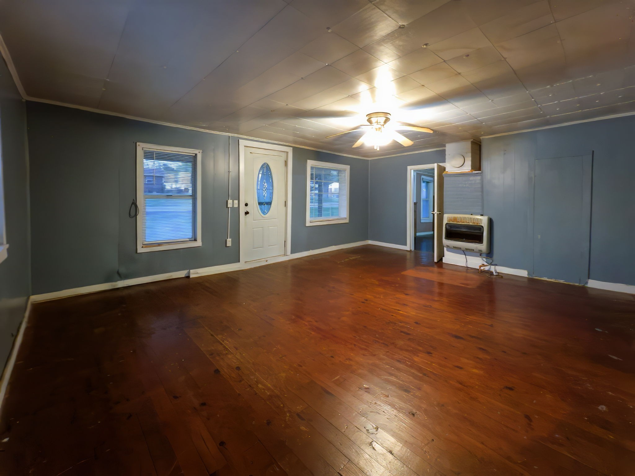 849 Jack Porter Road Lafayette, TN 37083 - Photo 19 of 56 an empty room with windows and fireplace