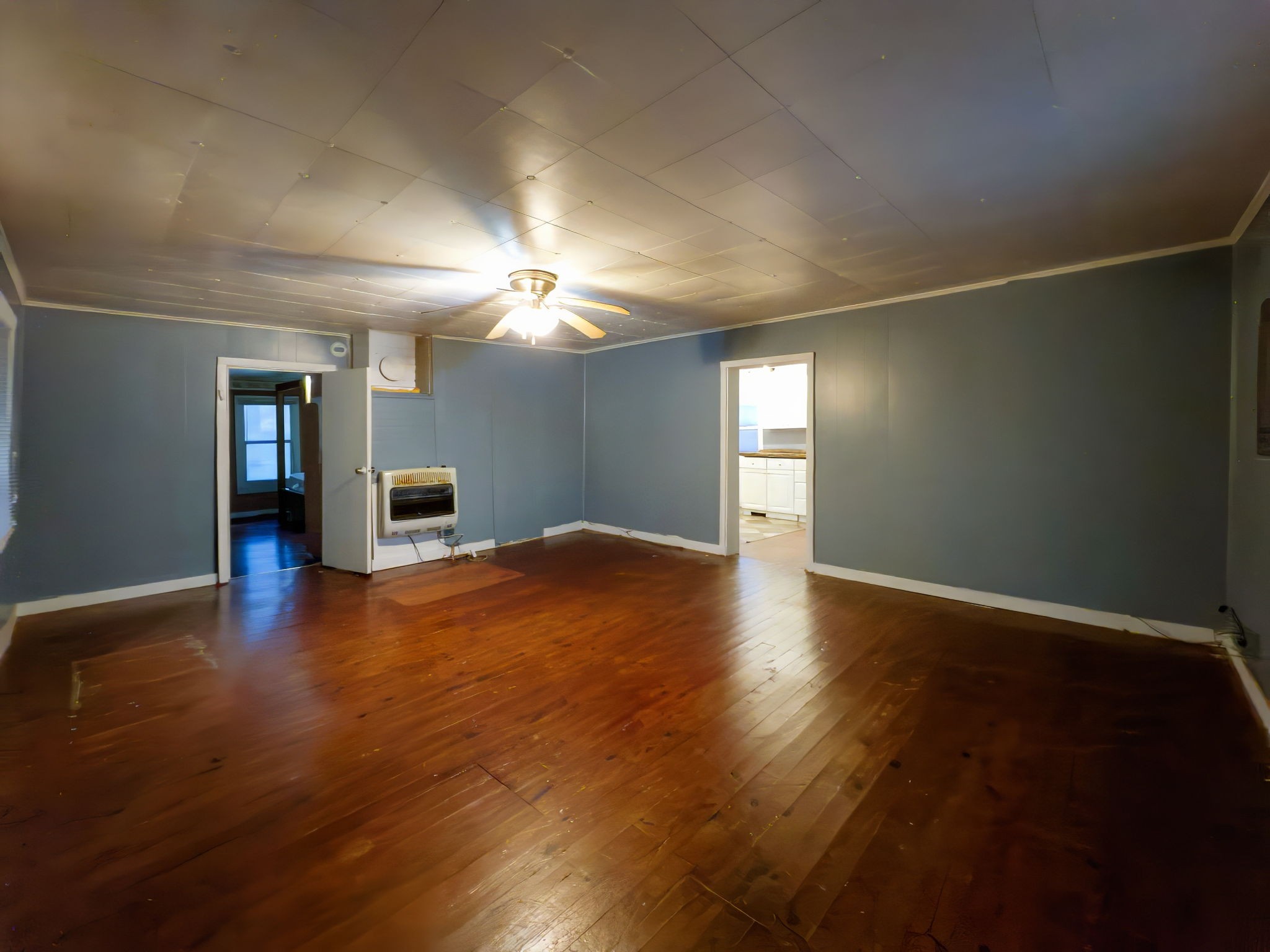 849 Jack Porter Road Lafayette, TN 37083 - Photo 20 of 56 an empty room with wooden floor and chandelier