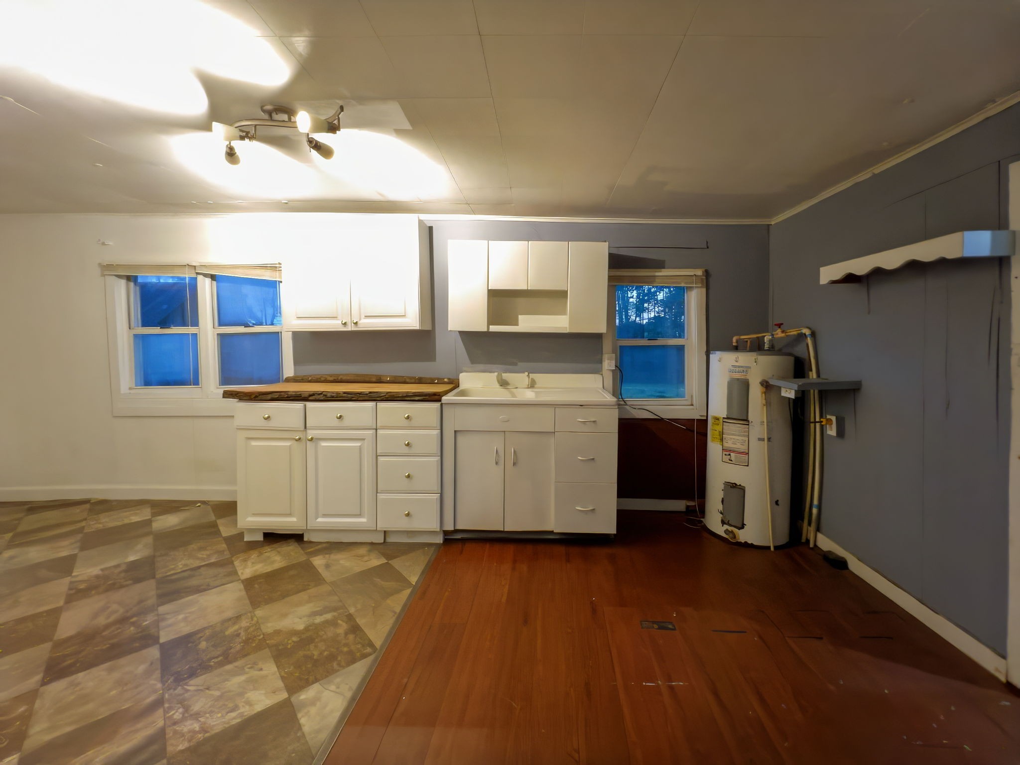 849 Jack Porter Road Lafayette, TN 37083 - Photo 22 of 56 a kitchen with a sink a refrigerator and wooden floor