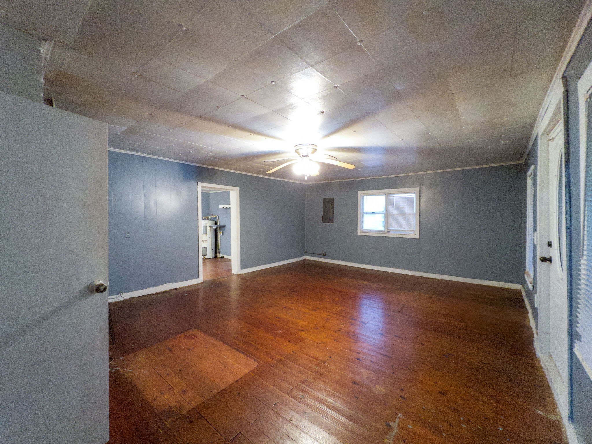 849 Jack Porter Road Lafayette, TN 37083 - Photo 25 of 56 an empty room with wooden floor and windows