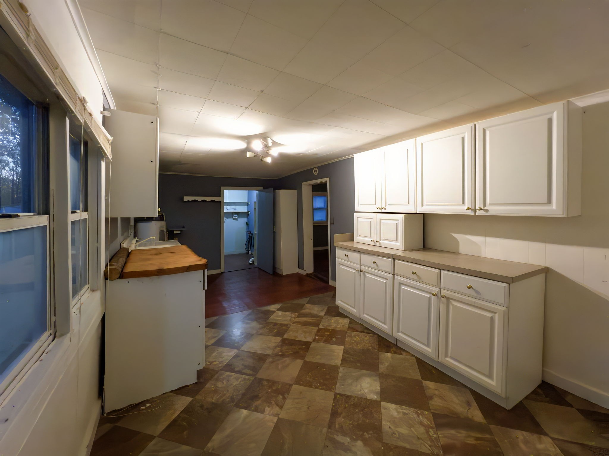 849 Jack Porter Road Lafayette, TN 37083 - Photo 27 of 56 a large kitchen with a large counter top sink and stainless steel appliances