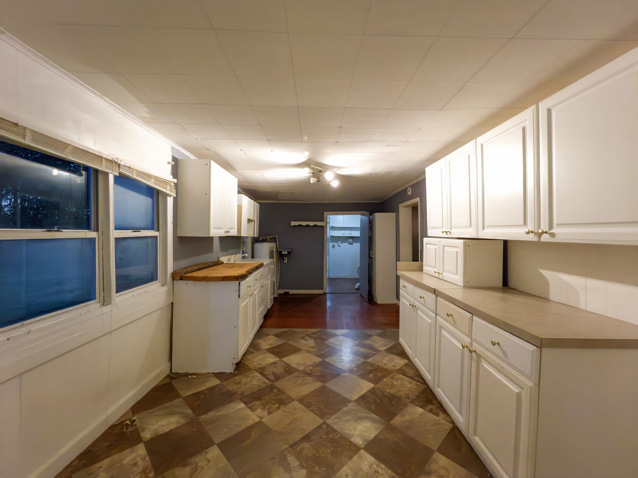 849 Jack Porter Road Lafayette, TN 37083 - Photo 34 of 56 a large white kitchen with cabinets a sink and appliances
