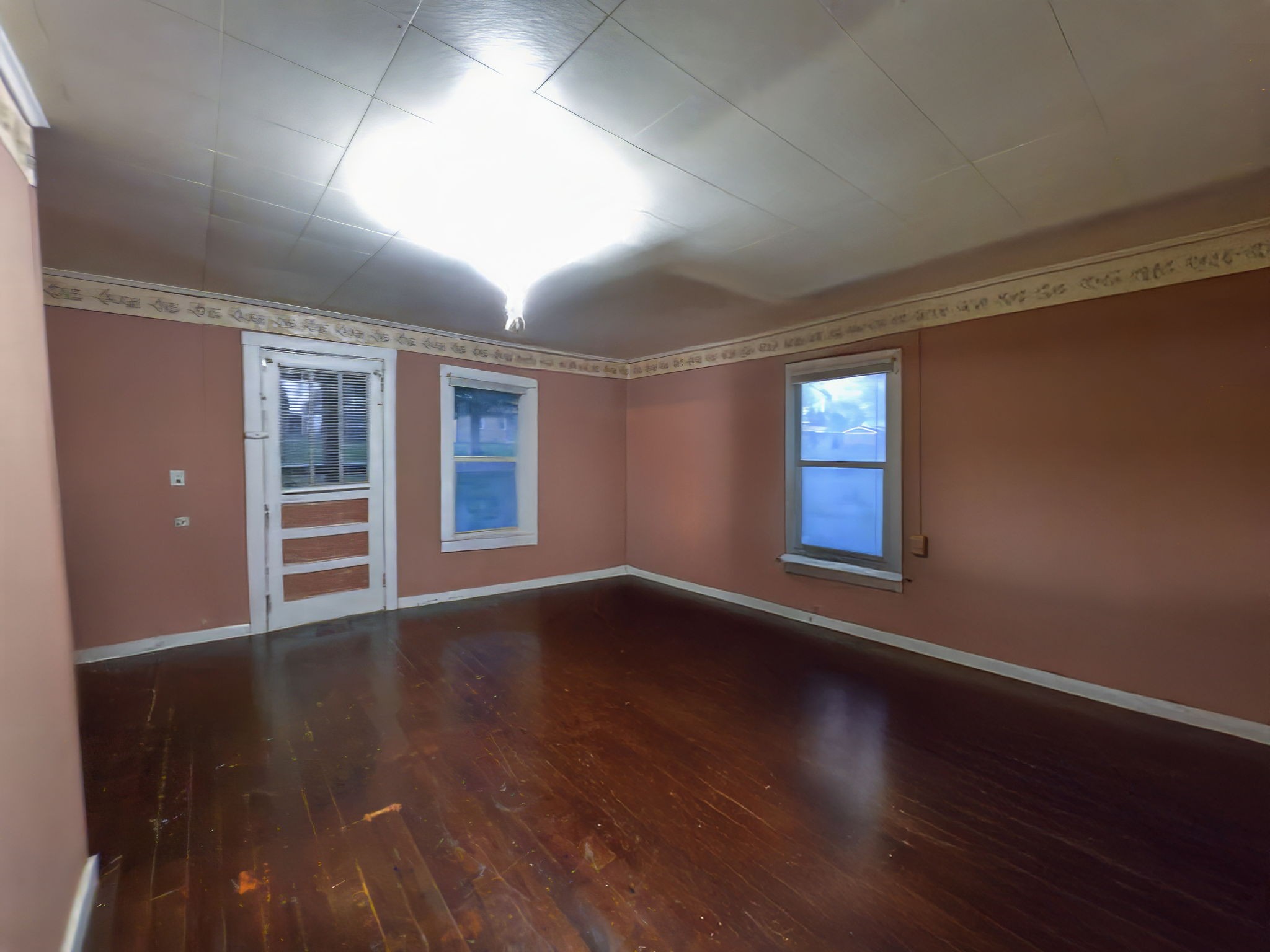 849 Jack Porter Road Lafayette, TN 37083 - Photo 39 of 56 a view of an empty room with wooden floor and windows