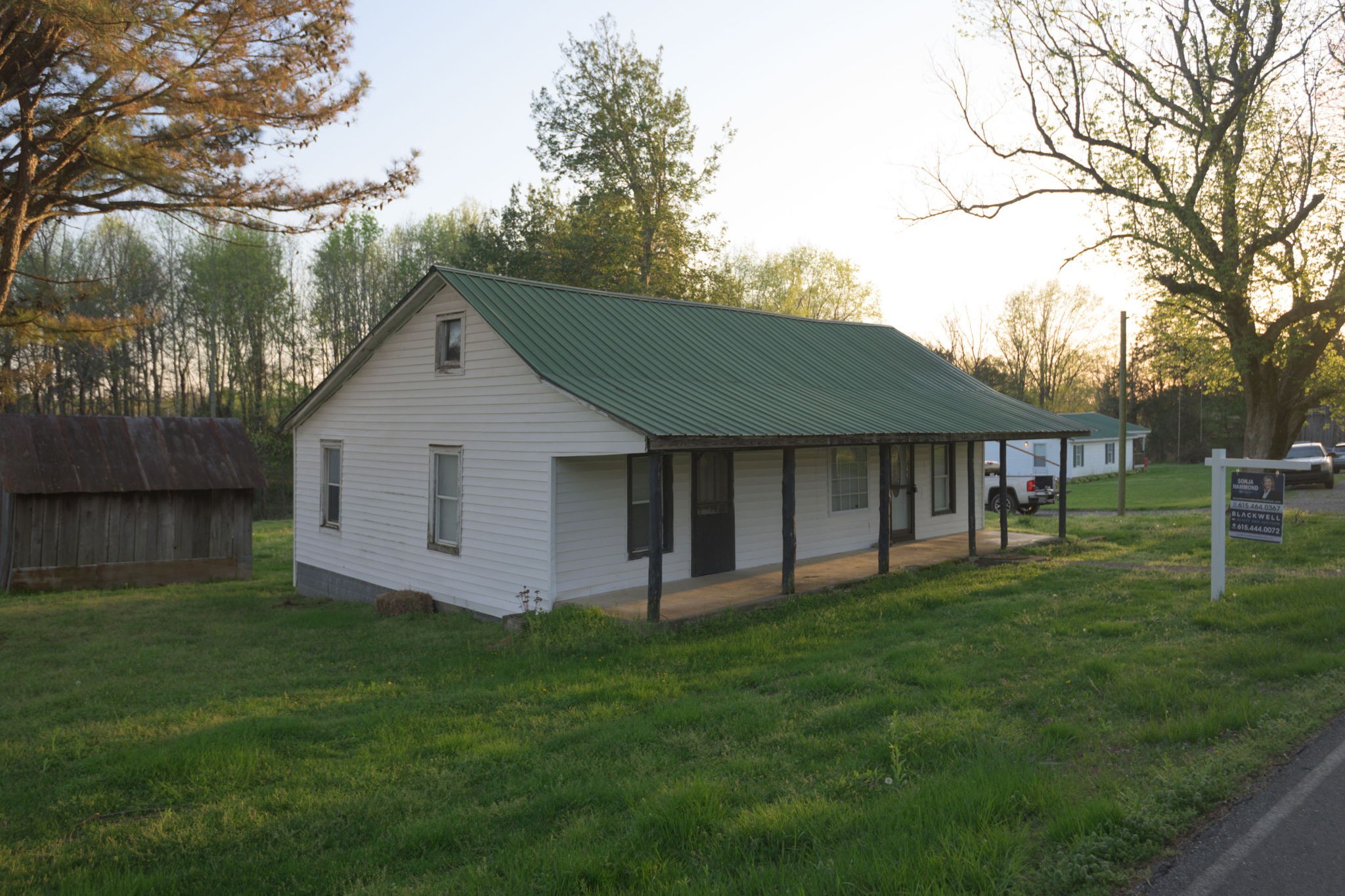 849 Jack Porter Road Lafayette, TN 37083 - Photo 4 of 56 a view of a yard in front of a house with large trees