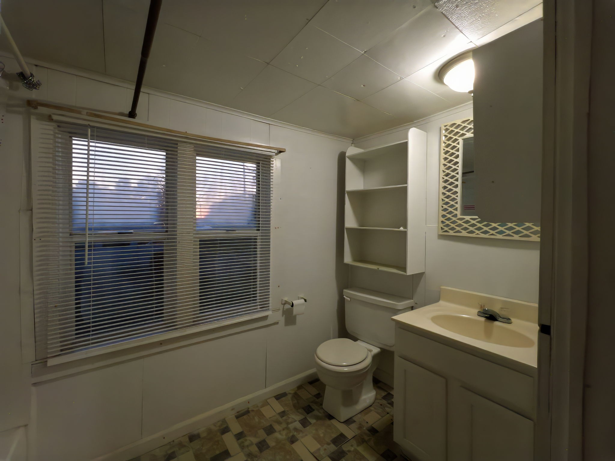 849 Jack Porter Road Lafayette, TN 37083 - Photo 49 of 56 a bathroom with a toilet sink and mirror