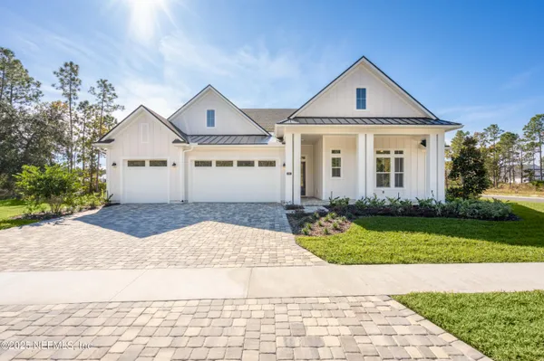 a view of swimming pool with chair and trees in the background