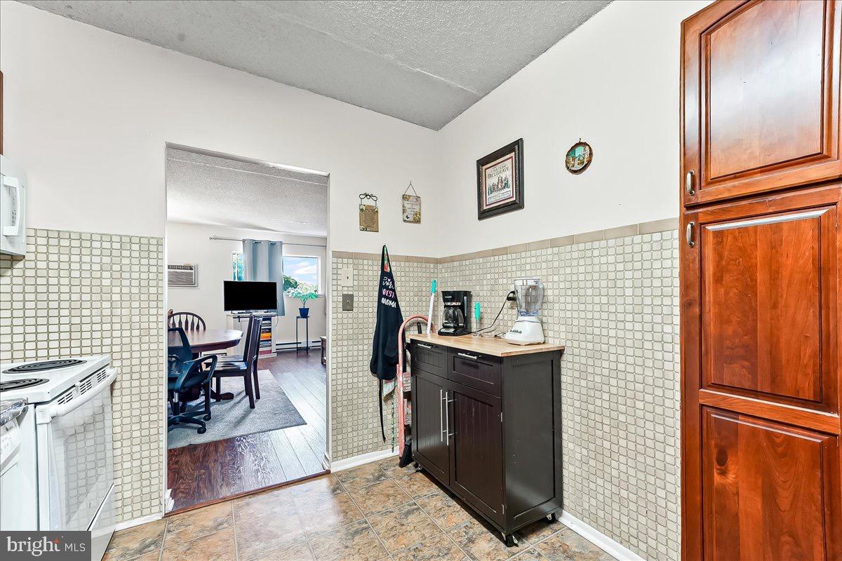 400 Glendale Road, Unit K52 Havertown, PA 19083 - Photo 12 of 17 a kitchen with stainless steel appliances granite countertop a refrigerator and a stove top oven
