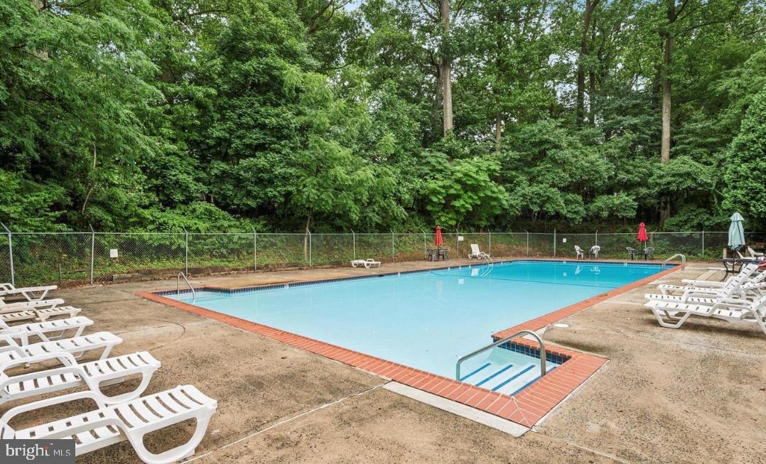 400 Glendale Road, Unit K52 Havertown, PA 19083 - Photo 17 of 17 a view of a tennis court with a large trees