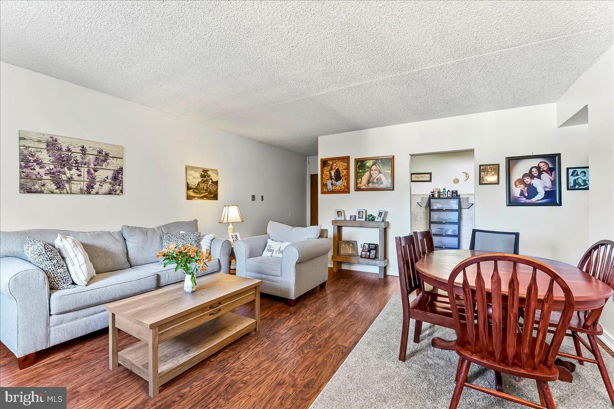 400 Glendale Road, Unit K52 Havertown, PA 19083 - Photo 2 of 17 a living room with furniture and wooden floor