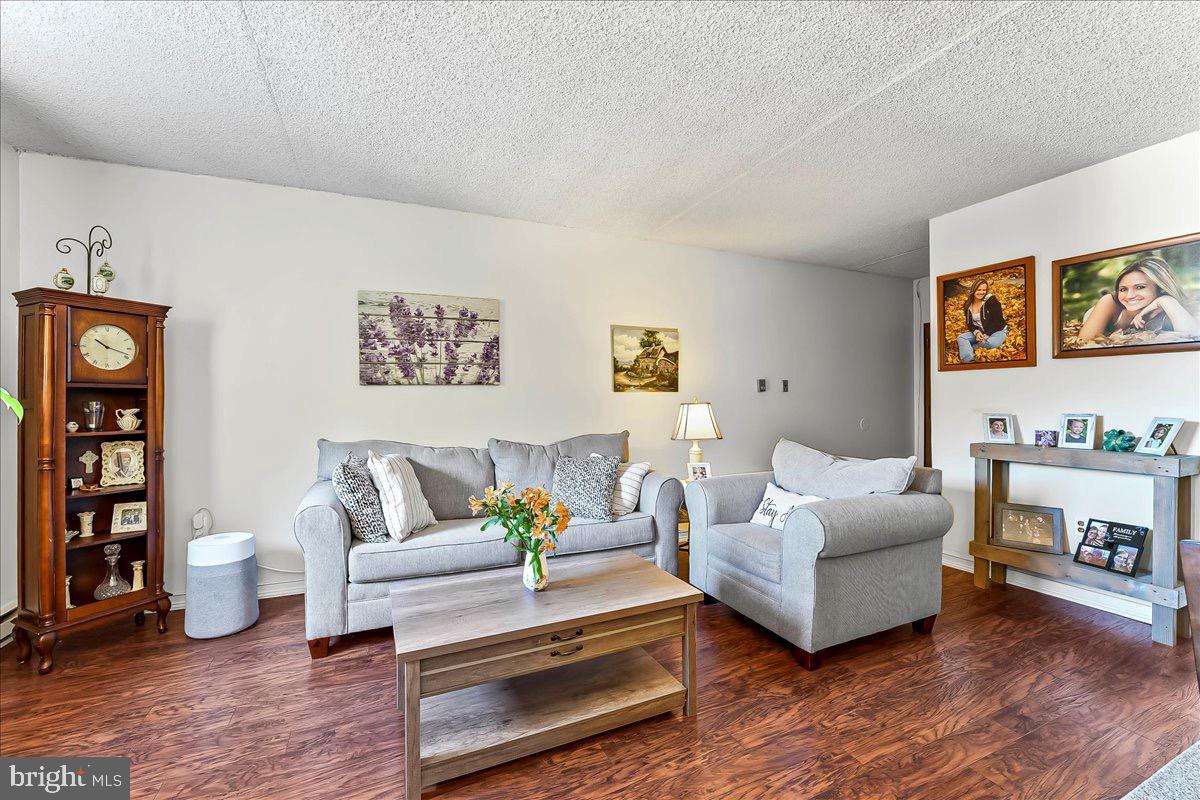 400 Glendale Road, Unit K52 Havertown, PA 19083 - Photo 4 of 17 a living room with furniture and a wooden floor
