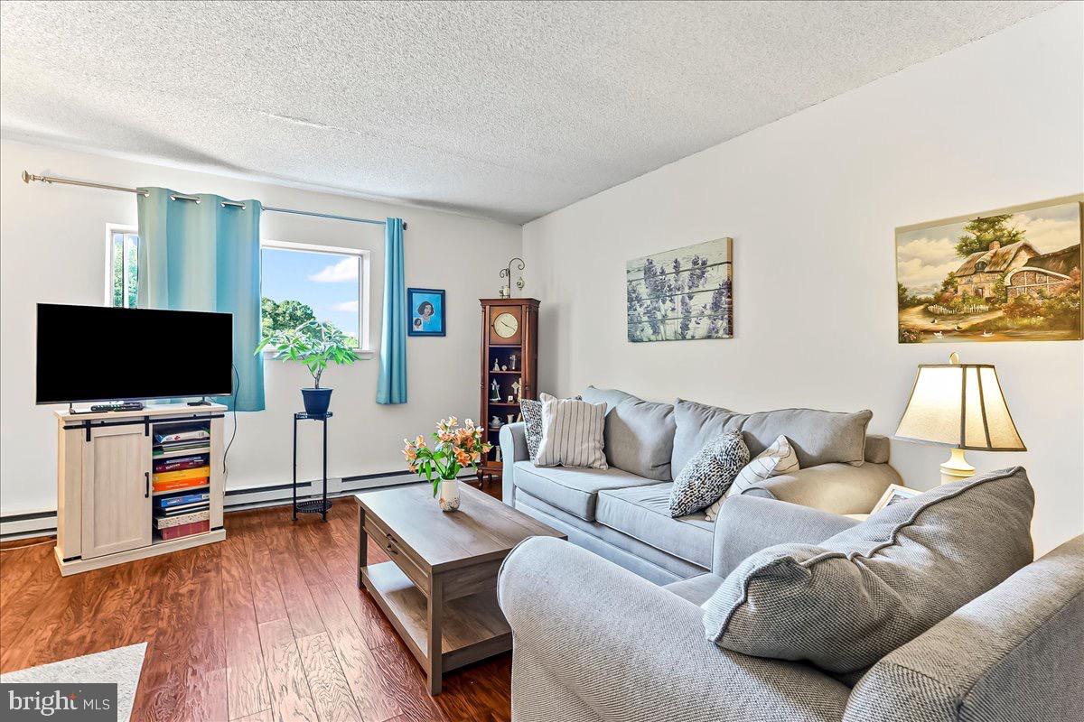 400 Glendale Road, Unit K52 Havertown, PA 19083 - Photo 5 of 17 a living room with furniture and a flat screen tv