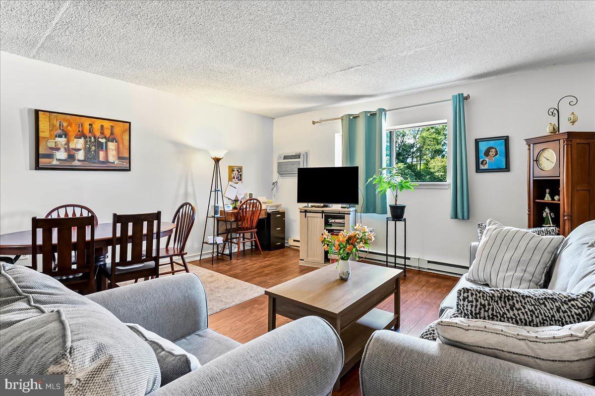 400 Glendale Road, Unit K52 Havertown, PA 19083 - Photo 6 of 17 a living room with furniture kitchen view and a flat screen tv