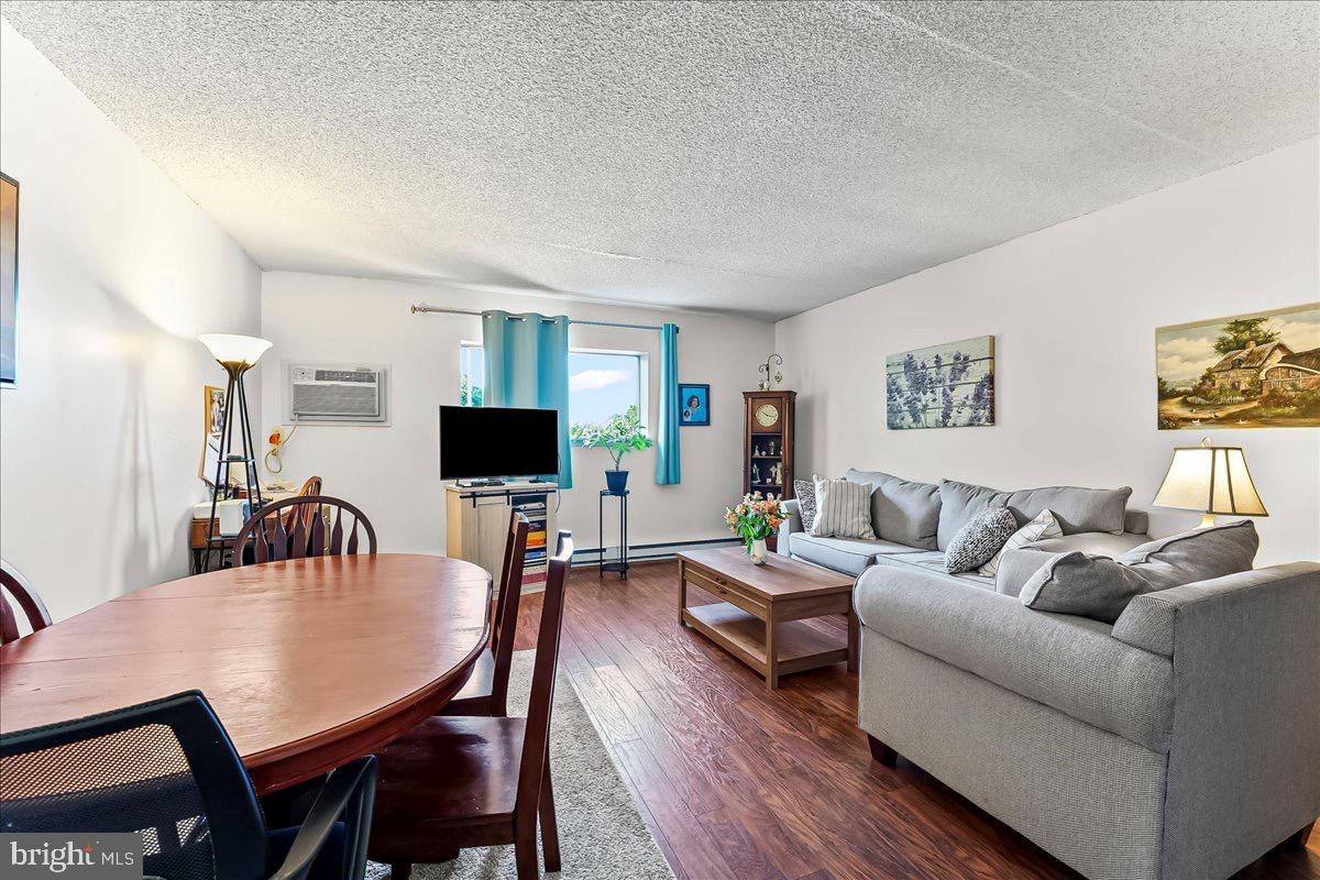 400 Glendale Road, Unit K52 Havertown, PA 19083 - Photo 7 of 17 a living room with furniture flat screen tv and a table