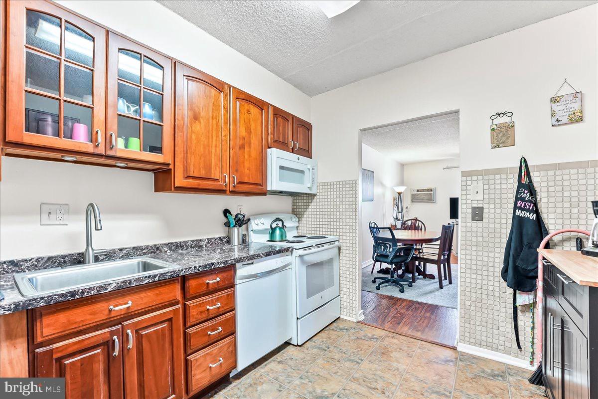 400 Glendale Road, Unit K52 Havertown, PA 19083 - Photo 10 of 17 a kitchen with stainless steel appliances granite countertop a sink and cabinets