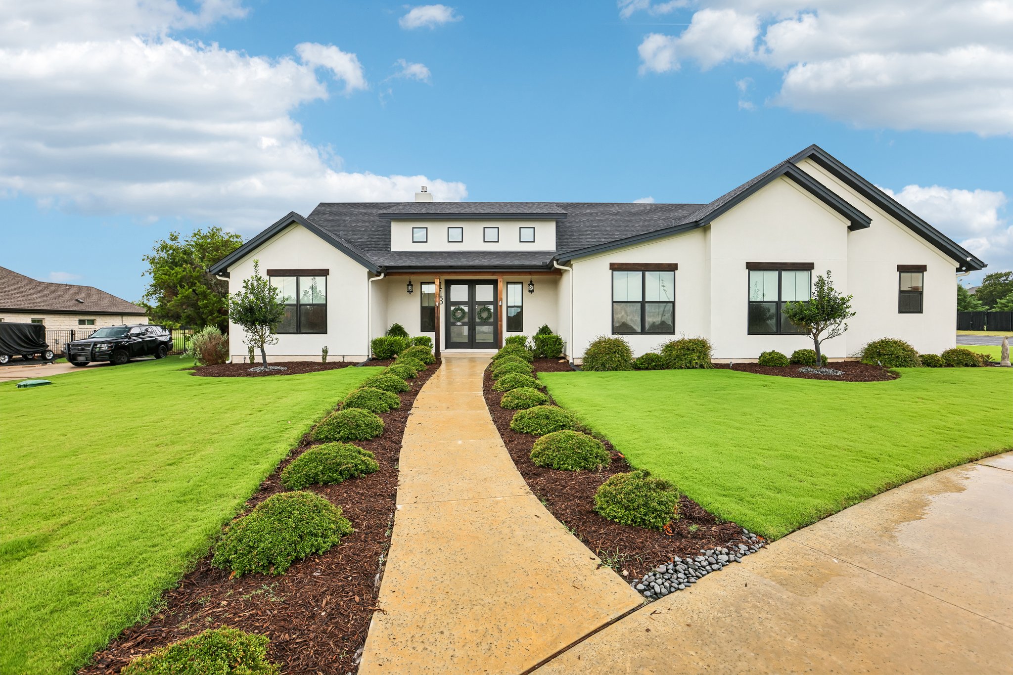 113 Crystal Lane Georgetown, TX 78633 - Photo 1 of 32 A gracefully curved pathway leads to the welcoming double entry doors of this well-maintained residence.