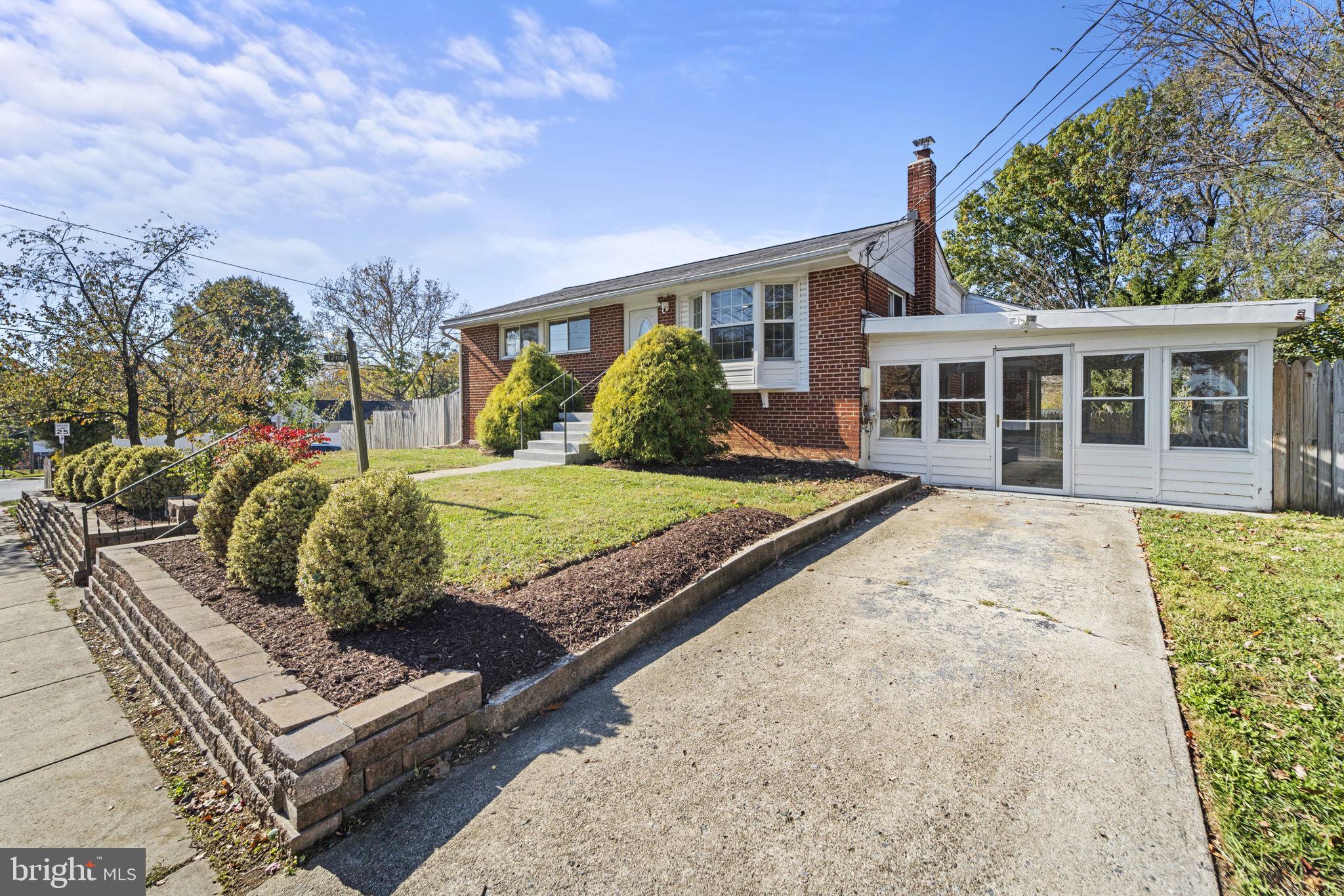12118 Livingston Street Silver Spring, MD 20902 - Photo 2 of 42 Driveway & screen-in porch
