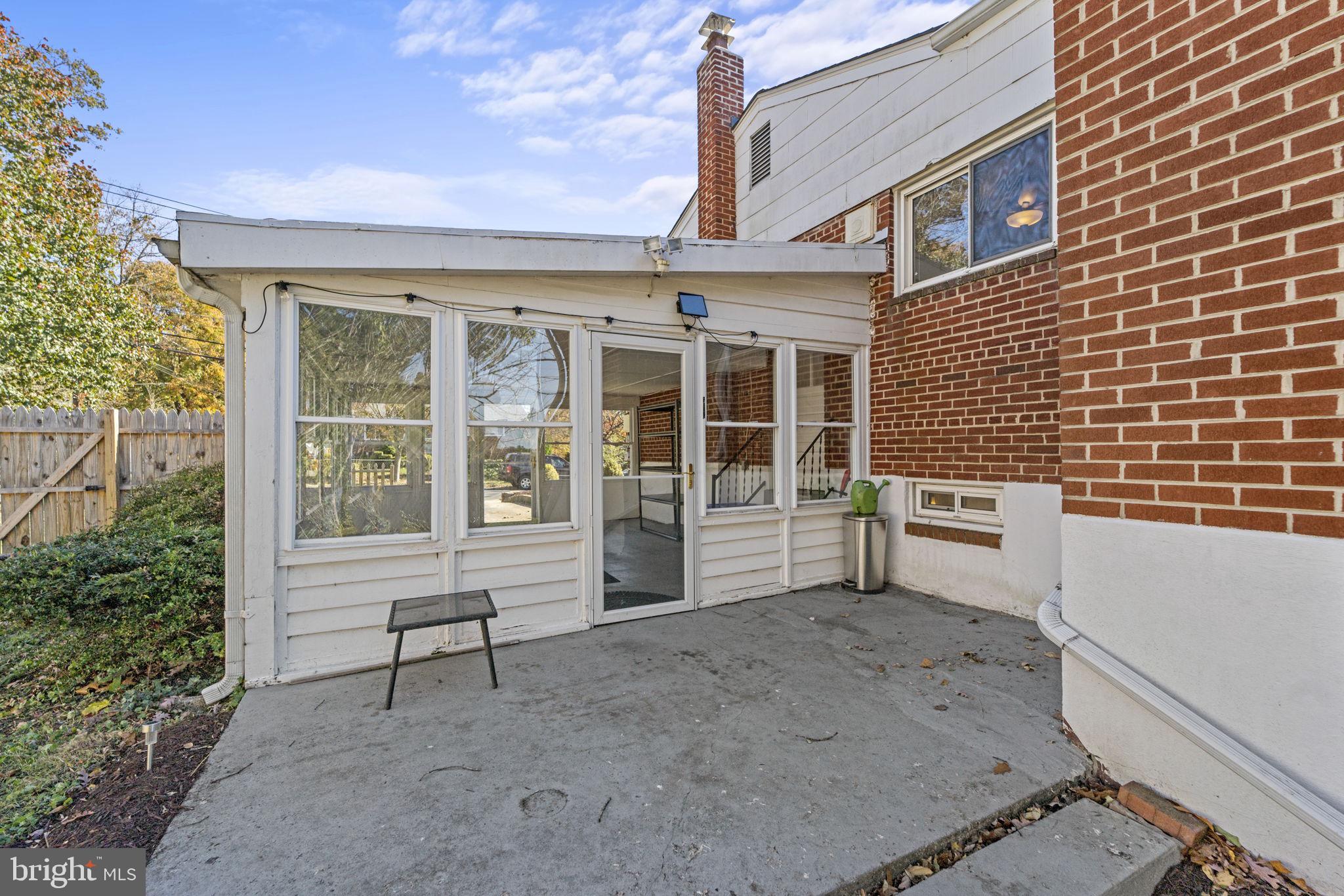 12118 Livingston Street Silver Spring, MD 20902 - Photo 37 of 42 Screened-in porch with patio