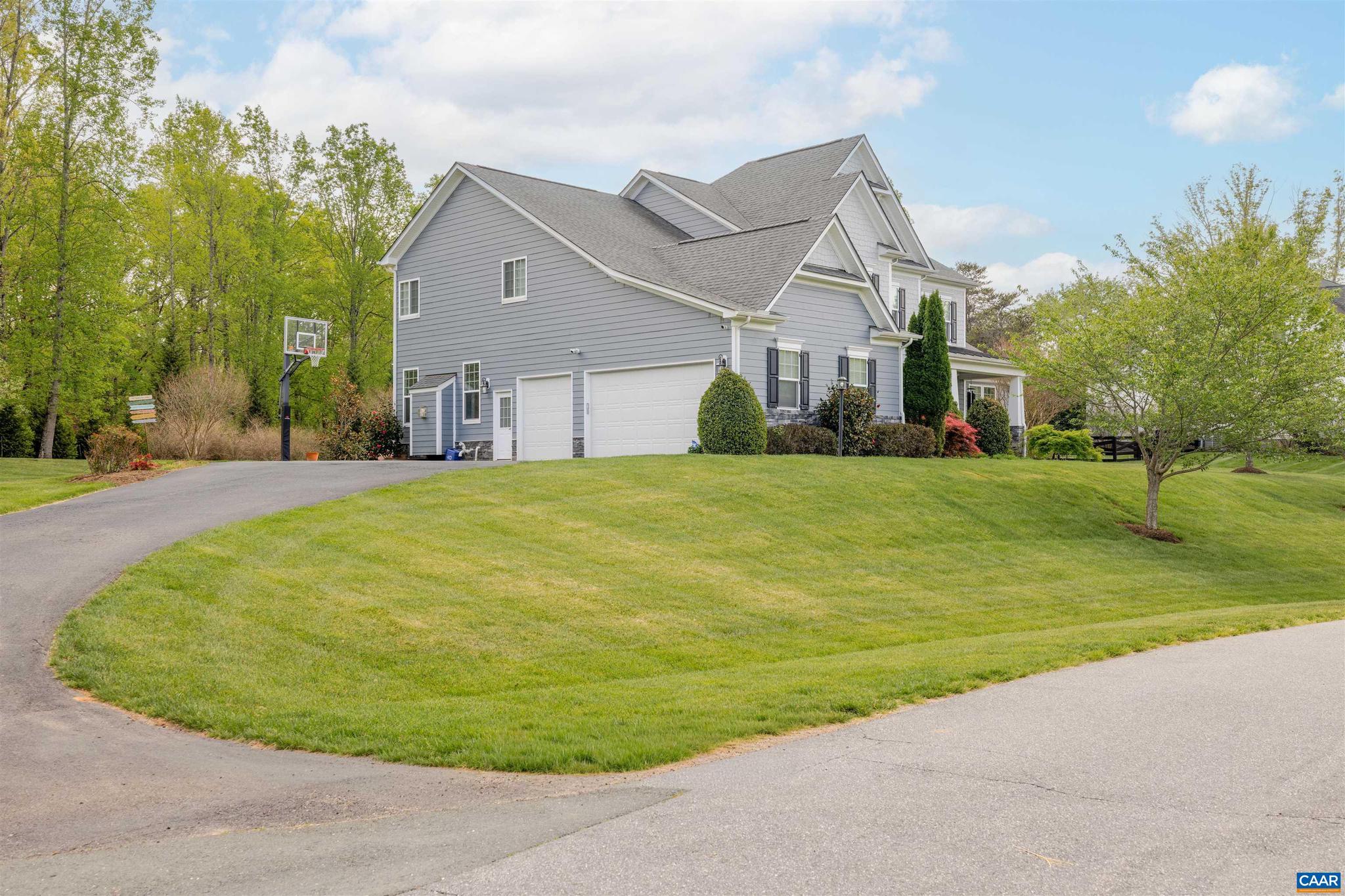 1630 Victor Place Charlottesville, VA 22903 - Photo 7 of 73 a view of a big house with a big yard and large trees