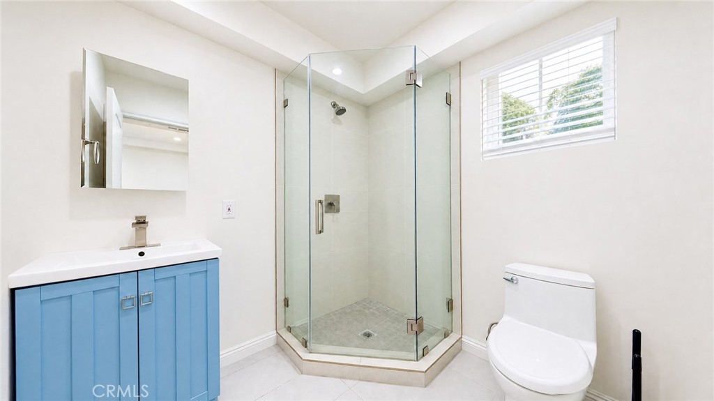6851 Foothill Boulevard Tujunga, CA 91042 - Photo 43 of 50 a bathroom with a granite countertop toilet sink and shower